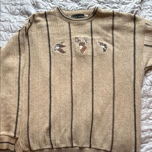Men's Tan Croft and Barrow sweater with embroidered duck, deer, and fish